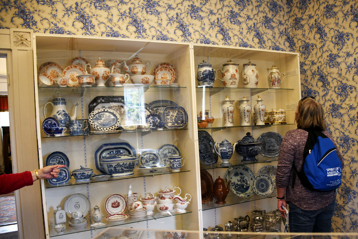 114 Joan Gocke admires the china display at the Hadwen House.jpg